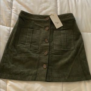 Olive mini skirt with button detail